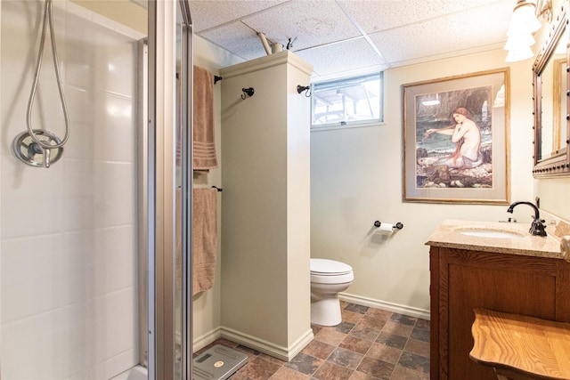2200 5th Ave, Helena, MT 59601 - bathroom with a shower stall, vanity, a paneled ceiling, and stone finish floors