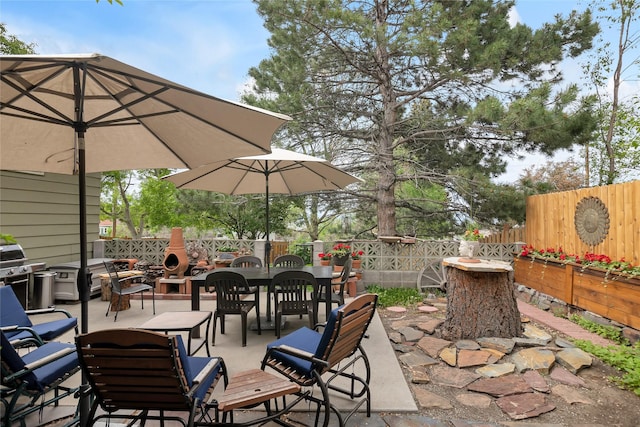 2200 5th Ave, Helena, MT 59601 - fenced backyard featuring outdoor dining area, a patio, and area for grilling