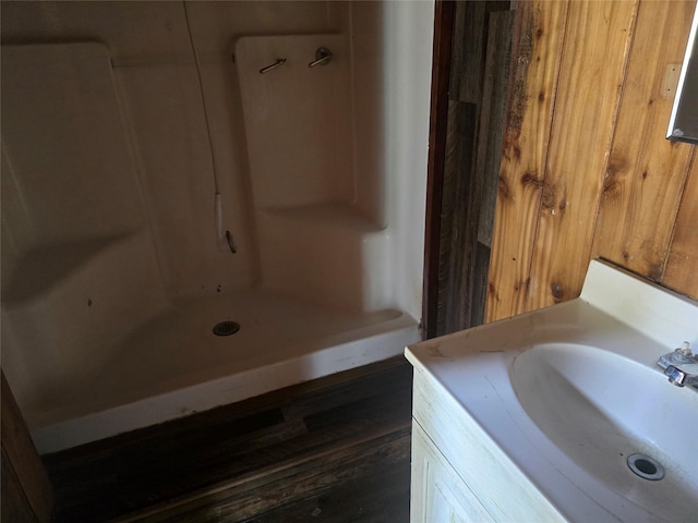 40 Larch Ln, Saint Regis, MT 59866 - full bathroom featuring vanity, a shower, and wood finished floors