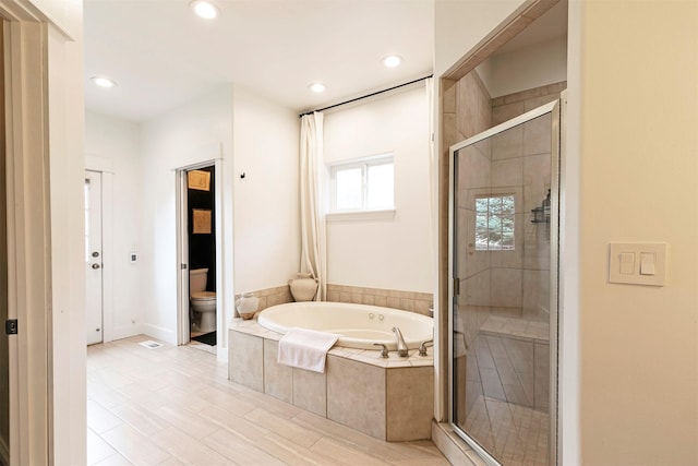 15660 Sara Jo Ln, Frenchtown, MT 59834 - full bathroom featuring a garden tub, a stall shower, and recessed lighting