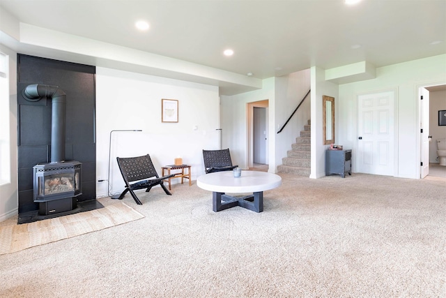 15660 Sara Jo Ln, Frenchtown, MT 59834 - sitting room featuring carpet flooring, stairway, a wood stove, and recessed lighting