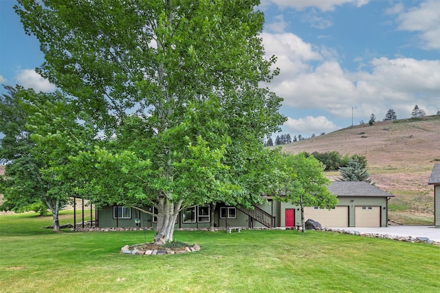 15660 Sara Jo Ln, Frenchtown, MT 59834 - view of front of home with concrete driveway, a front lawn, and stairs