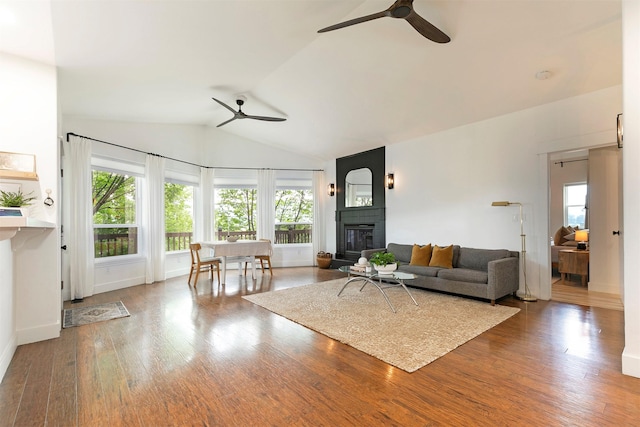 15660 Sara Jo Ln, Frenchtown, MT 59834 - living area featuring a ceiling fan, a fireplace, wood finished floors, and lofted ceiling
