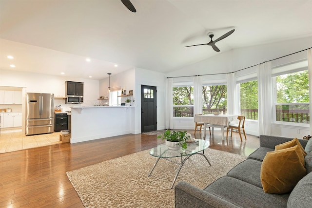 15660 Sara Jo Ln, Frenchtown, MT 59834 - living room featuring ceiling fan, recessed lighting, light wood finished floors, and lofted ceiling