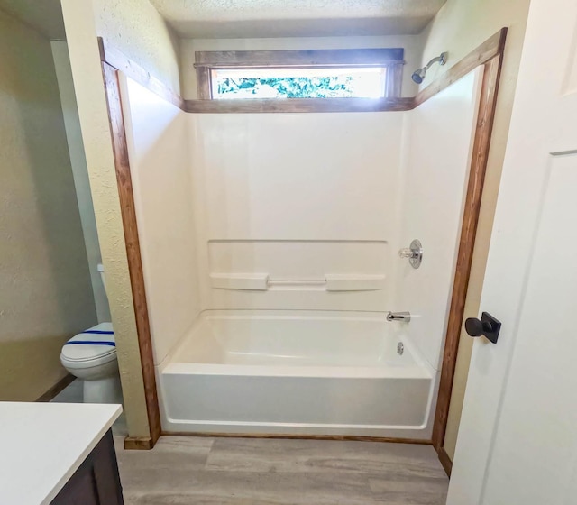 36240 Felsman St, Pablo, MT 59855 - bathroom with vanity, shower / washtub combination, and wood finished floors