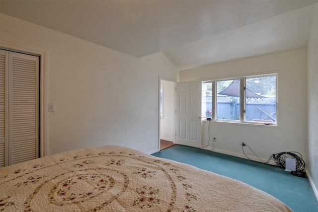 3422 Rimini Rd, Helena, MT 59601 - bedroom featuring carpet flooring, vaulted ceiling, and a closet