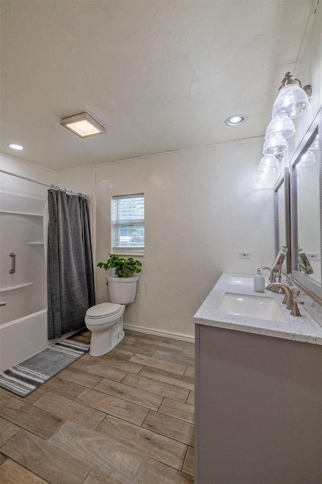 3422 Rimini Rd, Helena, MT 59601 - bathroom featuring double vanity, wood tiled floors, shower / bath combo, and recessed lighting
