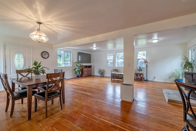 3422 Rimini Rd, Helena, MT 59601 - dining room featuring plenty of natural light, light wood-style floors, and a chandelier
