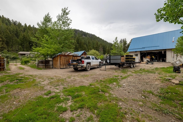 3422 Rimini Rd, Helena, MT 59601 - view of yard with an outbuilding and a view of trees