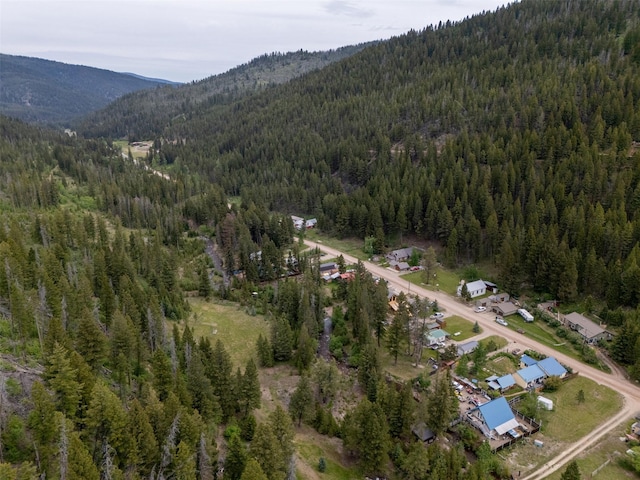 3422 Rimini Rd, Helena, MT 59601 - aerial view of property's location featuring a heavily wooded area and mountains