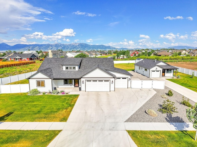 915 Stewart Loop, Bozeman, MT 59718 - modern farmhouse featuring a residential view, driveway, an attached garage, and a mountain view