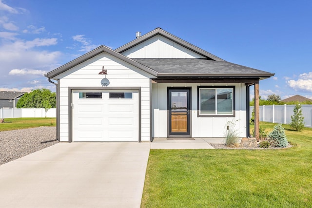 915 Stewart Loop, Bozeman, MT 59718 - view of front of property with board and batten siding, concrete driveway, an attached garage, and roof with shingles