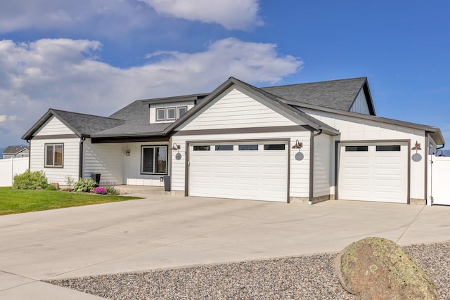 915 Stewart Loop, Bozeman, MT 59718 - view of front facade featuring an attached garage, concrete driveway, and roof with shingles