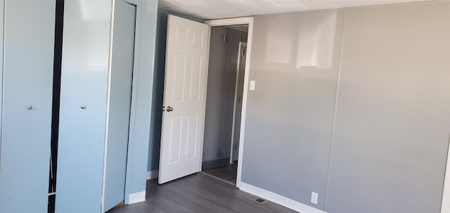 1805 Joslyn St Unit 25, Helena, MT 59601 - unfurnished bedroom with dark wood-style flooring and a closet