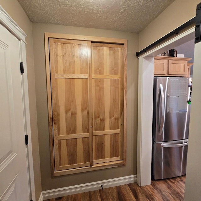 104 39th Ave NE, Great Falls, MT 59404 - kitchen with freestanding refrigerator, dark wood-style flooring, and a textured ceiling