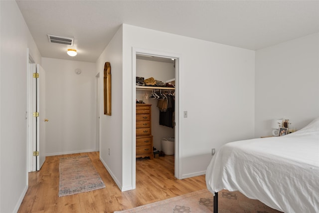 251 Grandview Way, Missoula, MT 59803 - bedroom featuring light wood-style flooring, a walk in closet, and a closet