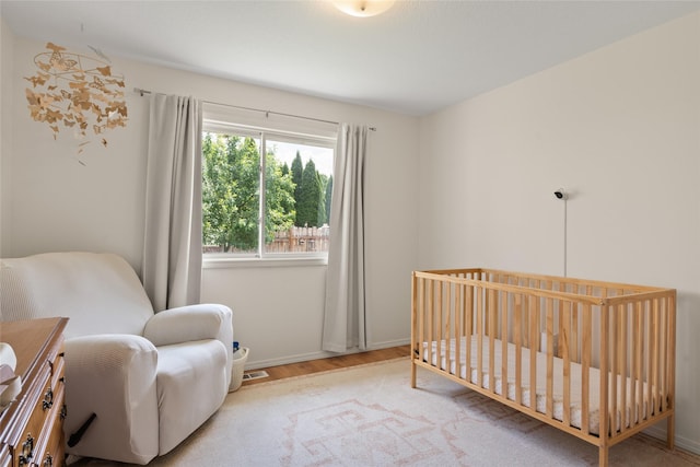 251 Grandview Way, Missoula, MT 59803 - bedroom with wood finished floors and a nursery area