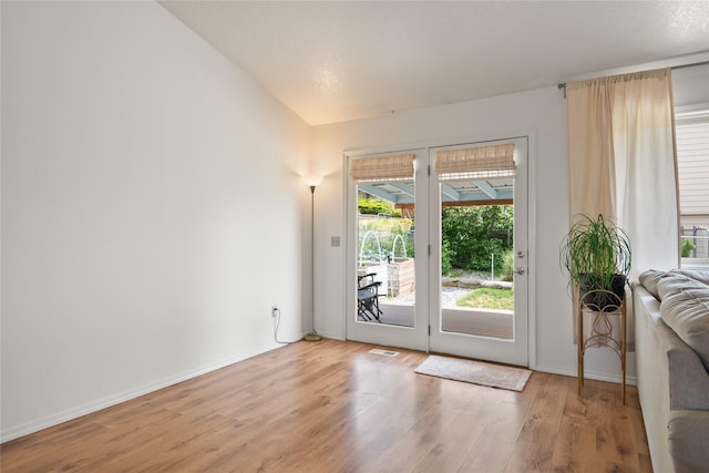 251 Grandview Way, Missoula, MT 59803 - doorway to outside with wood finished floors and lofted ceiling
