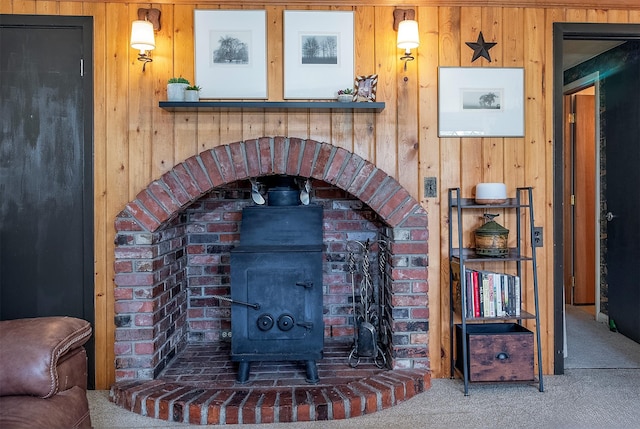 429 Pleasant Valley Rd, Marion, MT 59925 - detailed view of carpet, wooden walls, and a wood stove