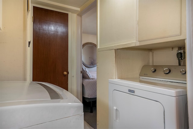 429 Pleasant Valley Rd, Marion, MT 59925 - washroom featuring washing machine and clothes dryer and cabinet space