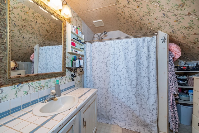429 Pleasant Valley Rd, Marion, MT 59925 - bathroom with vanity, wallpapered walls, and curtained shower