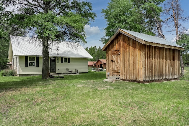 429 Pleasant Valley Rd, Marion, MT 59925 - view of green lawn featuring an outbuilding