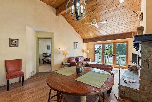7 Eagle Bend Dr, Bigfork, MT 59911 - dining space with high vaulted ceiling, a wood ceiling with exposed beams, wood finished floors, ceiling fan, and a chandelier