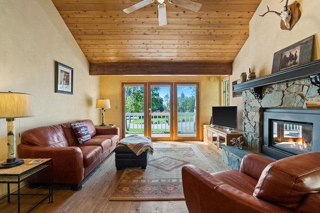 7 Eagle Bend Dr, Bigfork, MT 59911 - living room featuring wooden ceiling, hardwood / wood-style floors, high vaulted ceiling, a ceiling fan, and a fireplace