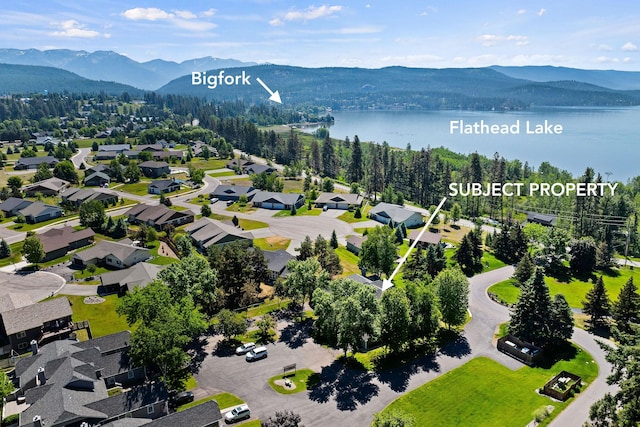 7 Eagle Bend Dr, Bigfork, MT 59911 - drone / aerial view of a water and mountain view