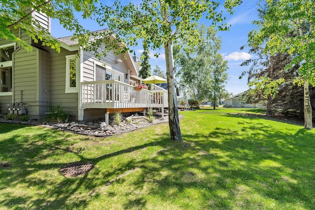 7 Eagle Bend Dr, Bigfork, MT 59911 - view of grassy yard with a wooden deck