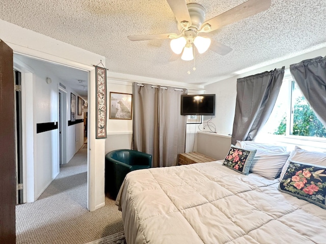 643 Madison Way, Great Falls, MT 59404 - bedroom featuring a textured ceiling, carpet flooring, and ceiling fan