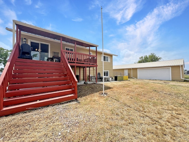 643 Madison Way, Great Falls, MT 59404 - rear view of property featuring stairs, a wooden deck, an outbuilding, and a garage