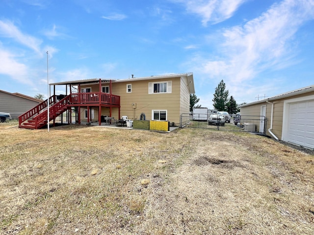 643 Madison Way, Great Falls, MT 59404 - back of property featuring stairway, a deck, a patio area, and a gate