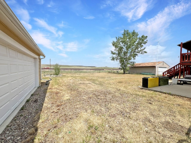 643 Madison Way, Great Falls, MT 59404 - view of yard featuring a patio and a garage