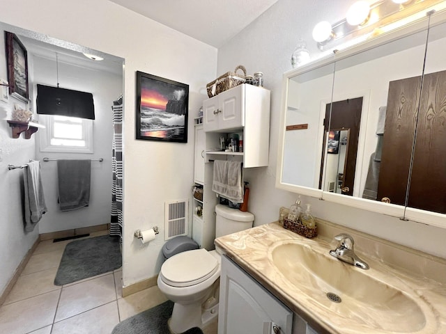 643 Madison Way, Great Falls, MT 59404 - bathroom featuring vanity, tile patterned flooring, and a towel warmer