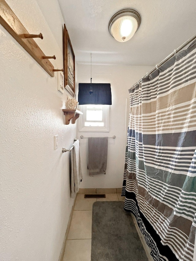 643 Madison Way, Great Falls, MT 59404 - bathroom featuring tile patterned flooring and a shower with shower curtain