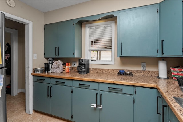 521 2nd Ave SW, Great Falls, MT 59404 - kitchen featuring light tile patterned floors and light countertops