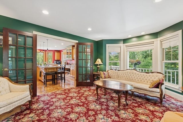 420 Little Creek Ln, Whitefish, MT 59937 - living area with healthy amount of natural light, recessed lighting, french doors, and light tile patterned floors