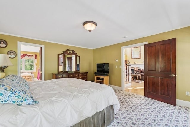 420 Little Creek Ln, Whitefish, MT 59937 - bedroom with crown molding, carpet flooring, and ensuite bathroom