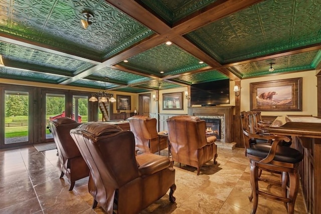 420 Little Creek Ln, Whitefish, MT 59937 - cinema featuring beamed ceiling, a glass covered fireplace, and coffered ceiling