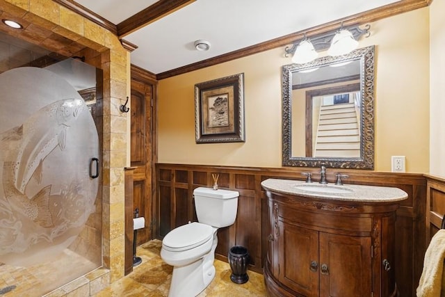 420 Little Creek Ln, Whitefish, MT 59937 - bathroom featuring crown molding, a shower stall, vanity, a wainscoted wall, and a decorative wall