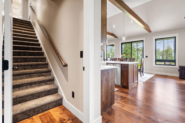 331 Deer Creek Rd, Somers, MT 59932 - staircase with hardwood / wood-style floors, lofted ceiling, and recessed lighting