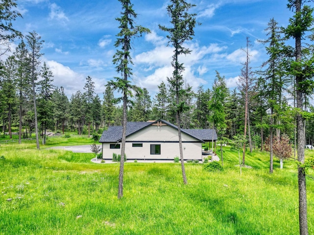331 Deer Creek Rd, Somers, MT 59932 - view of side of home featuring roof with shingles