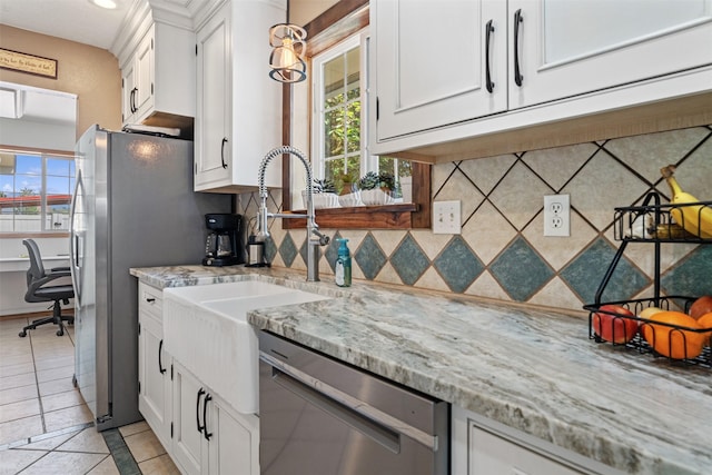 4786 Hereford Ln, Stevensville, MT 59870 - kitchen with stainless steel appliances, healthy amount of natural light, backsplash, white cabinets, and recessed lighting