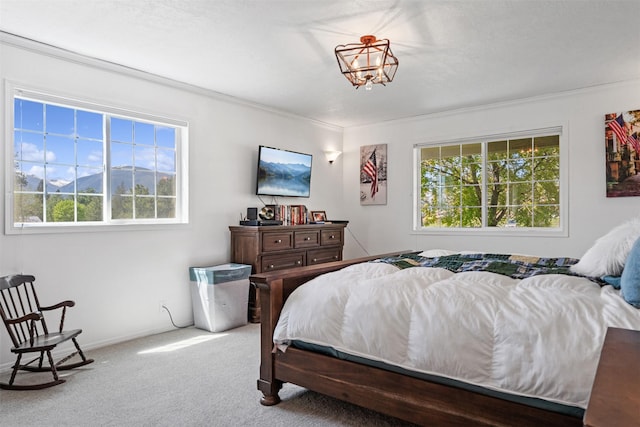 4786 Hereford Ln, Stevensville, MT 59870 - carpeted bedroom with ornamental molding and a chandelier