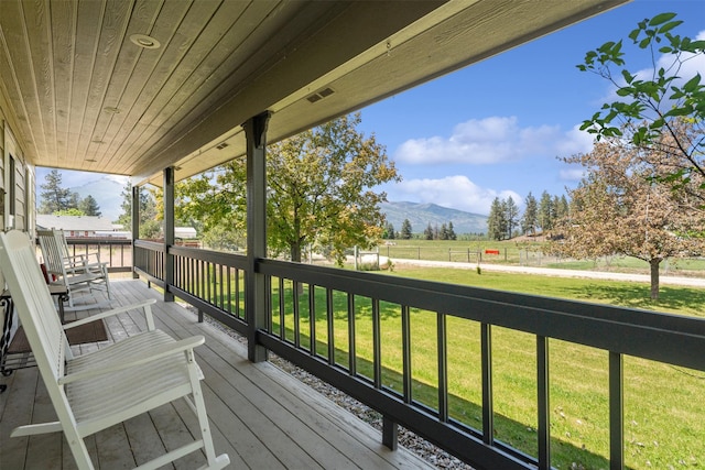 4786 Hereford Ln, Stevensville, MT 59870 - wooden terrace featuring a mountain view and a yard