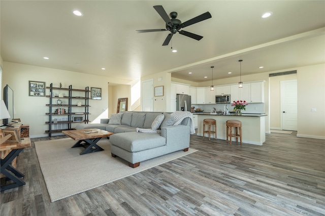 343 Meadow View Loop, East Helena, MT 59635 - living area with recessed lighting, wood finished floors, and ceiling fan