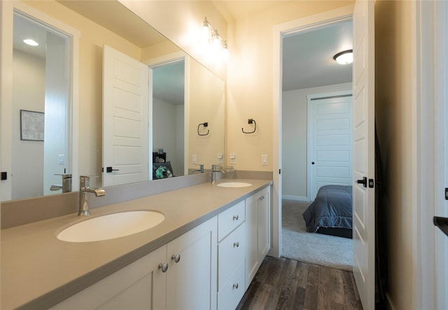 343 Meadow View Loop, East Helena, MT 59635 - ensuite bathroom featuring double vanity and wood finished floors