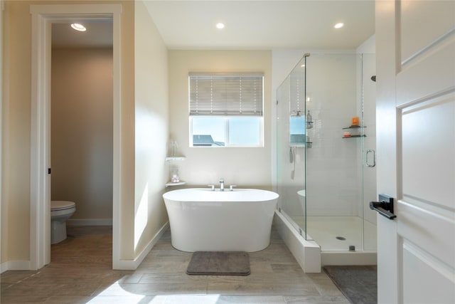 343 Meadow View Loop, East Helena, MT 59635 - bathroom featuring a freestanding tub, a shower stall, wood finished floors, and recessed lighting