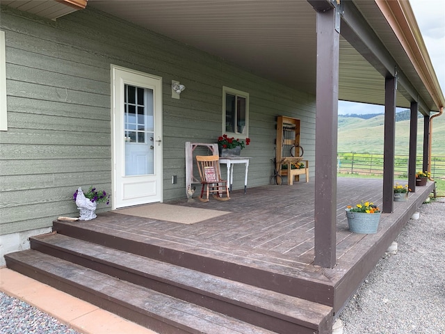 57870 Crow Dam Rd, Charlo, MT 59824 - wooden terrace with a mountain view